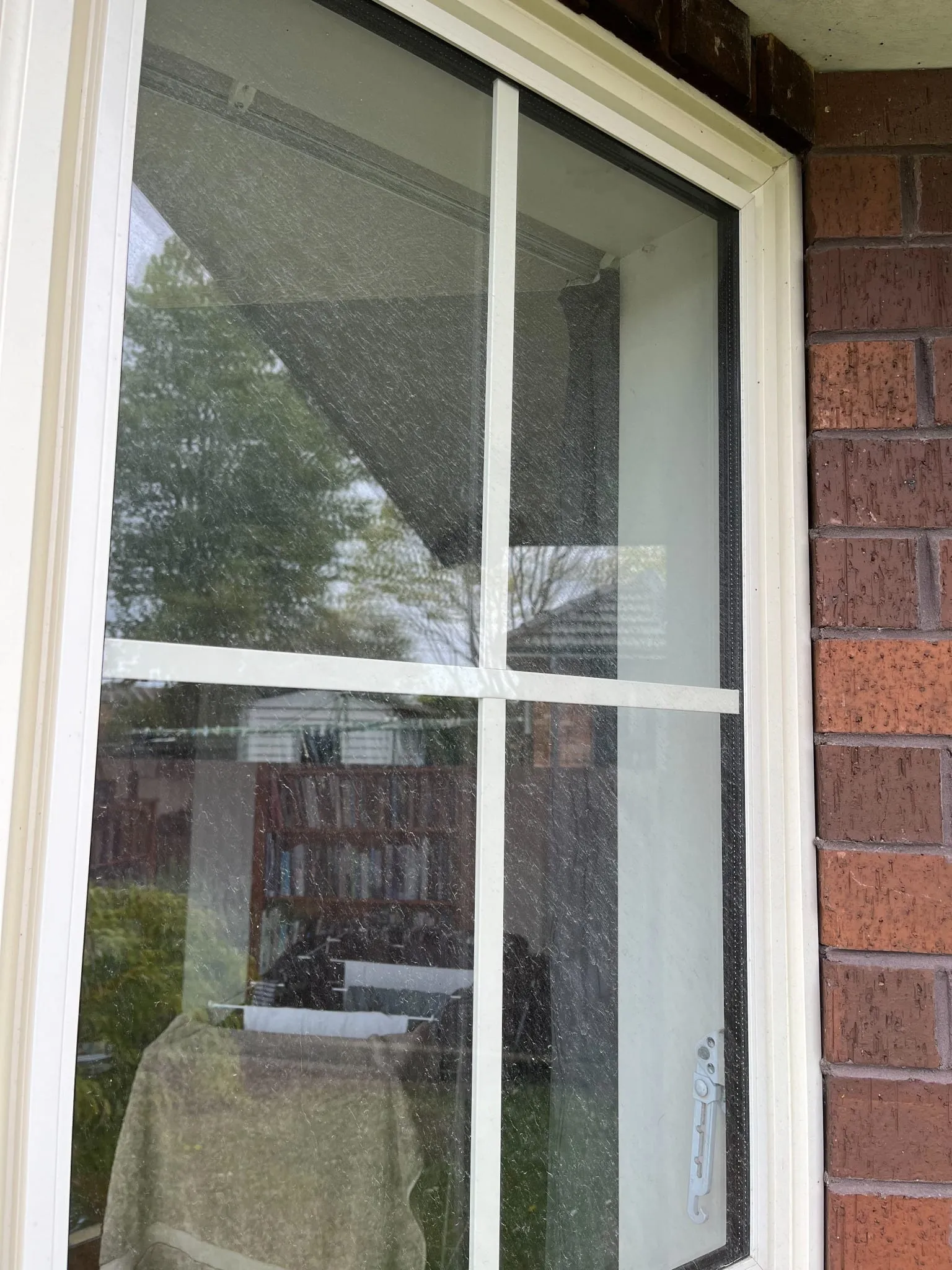 The same window before cleaning — covered in spots and grime
